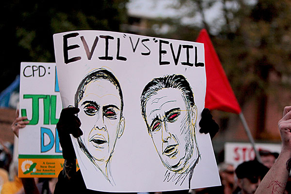 Protesters made Mitt Romney and Barack Obama out to be one in the same type of evil, and claimed our country would fail with either elected.