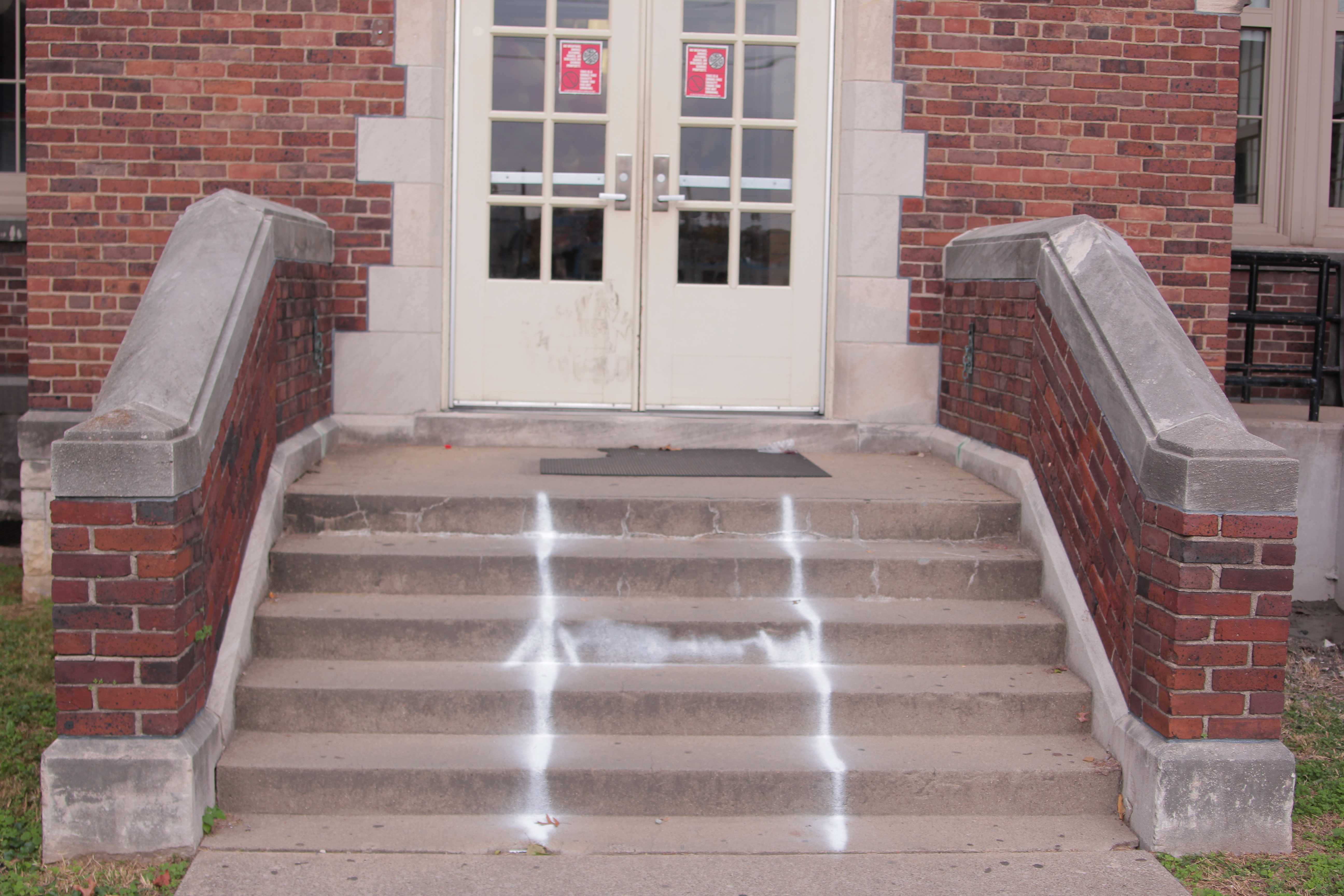 Today, after first block, Mr. Ed Burton (Security) saw a spray-painted H on the side steps of Manual. This was another vandalism prank suspected of Male students or affiliates. Photo by Tara Steiden