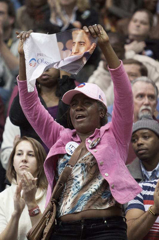 An+Obama+supporter+waves+a+sign+during+his+speech+at+the+University+of+Cincinnati.+Photo+by+Yazmin+Martinez.