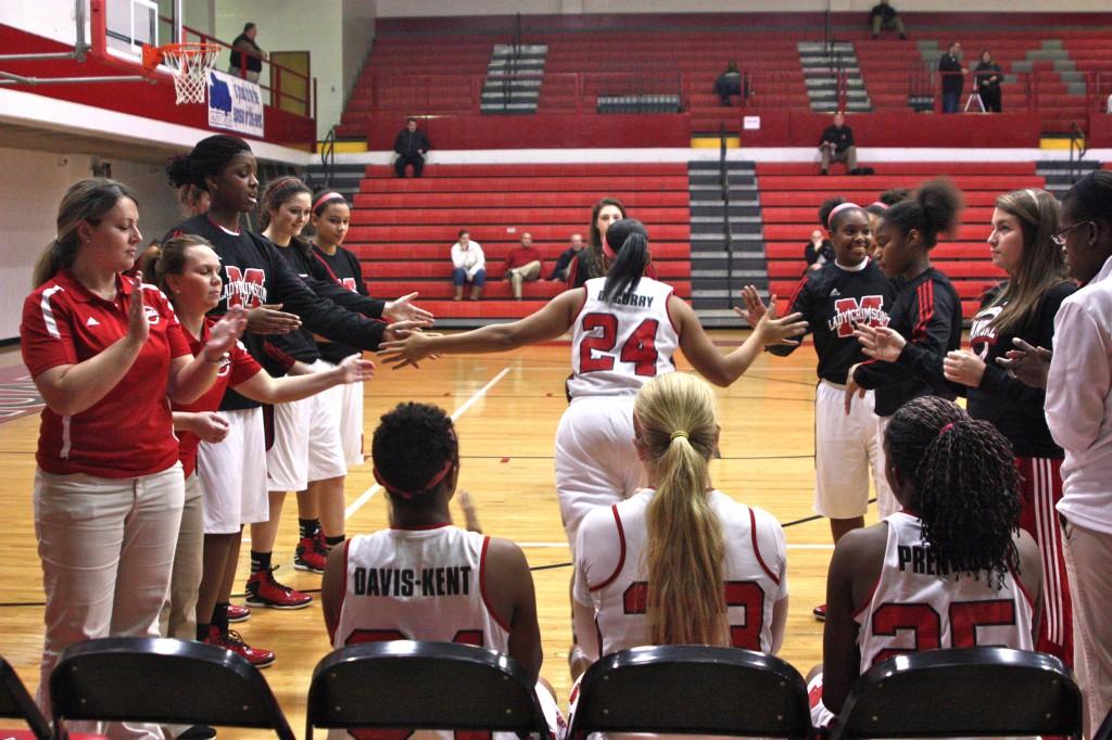Lady Crimsons introduce their starting line up. Destony Curry (12, #24)