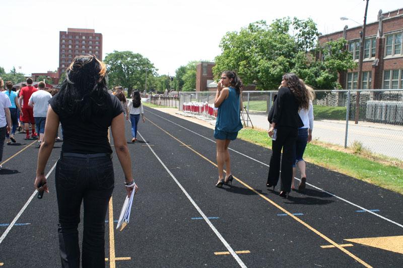 Ms. Johnson (Computer Apps Teacher) walks to her class destination on the football practice field.  Photo By: Alexis Weaver