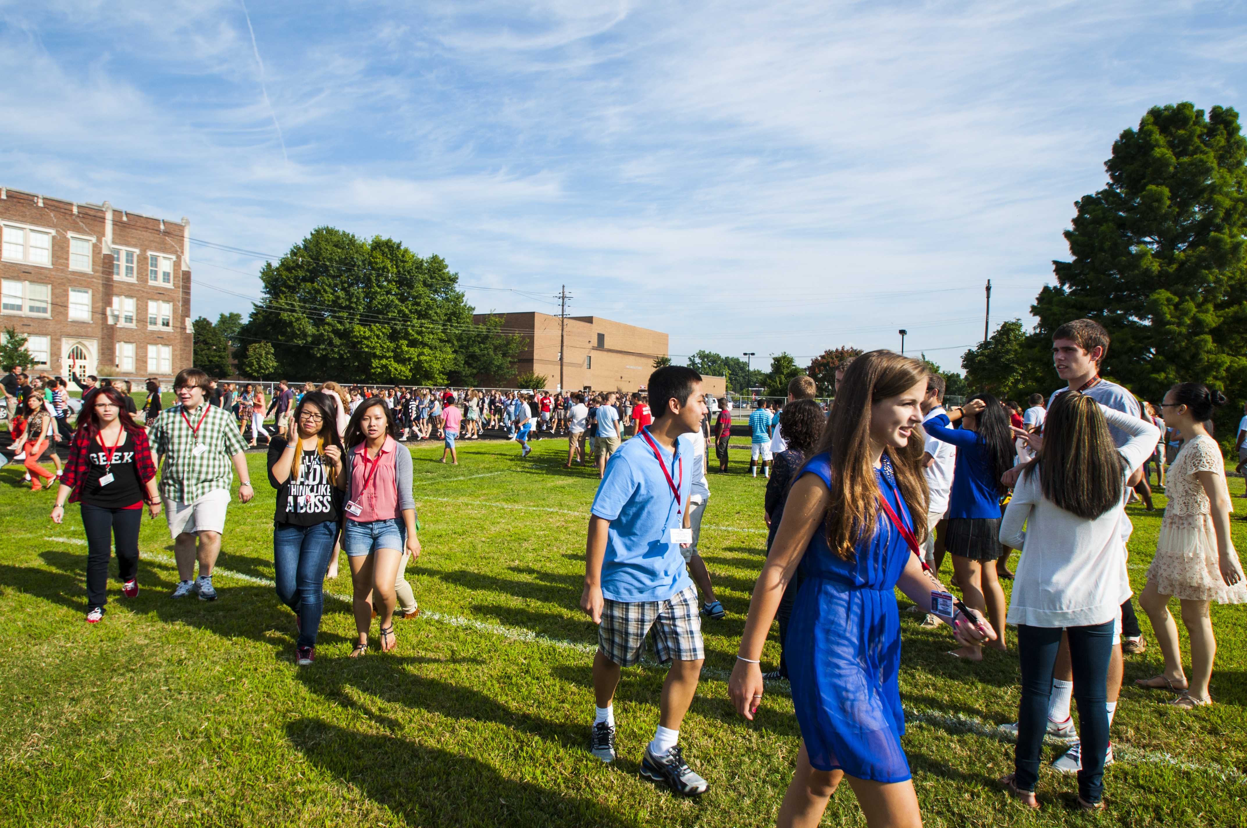 The still blazing, Summer heat beats down on students as they stand in the field. Photo by Jack Steele Mattingly 