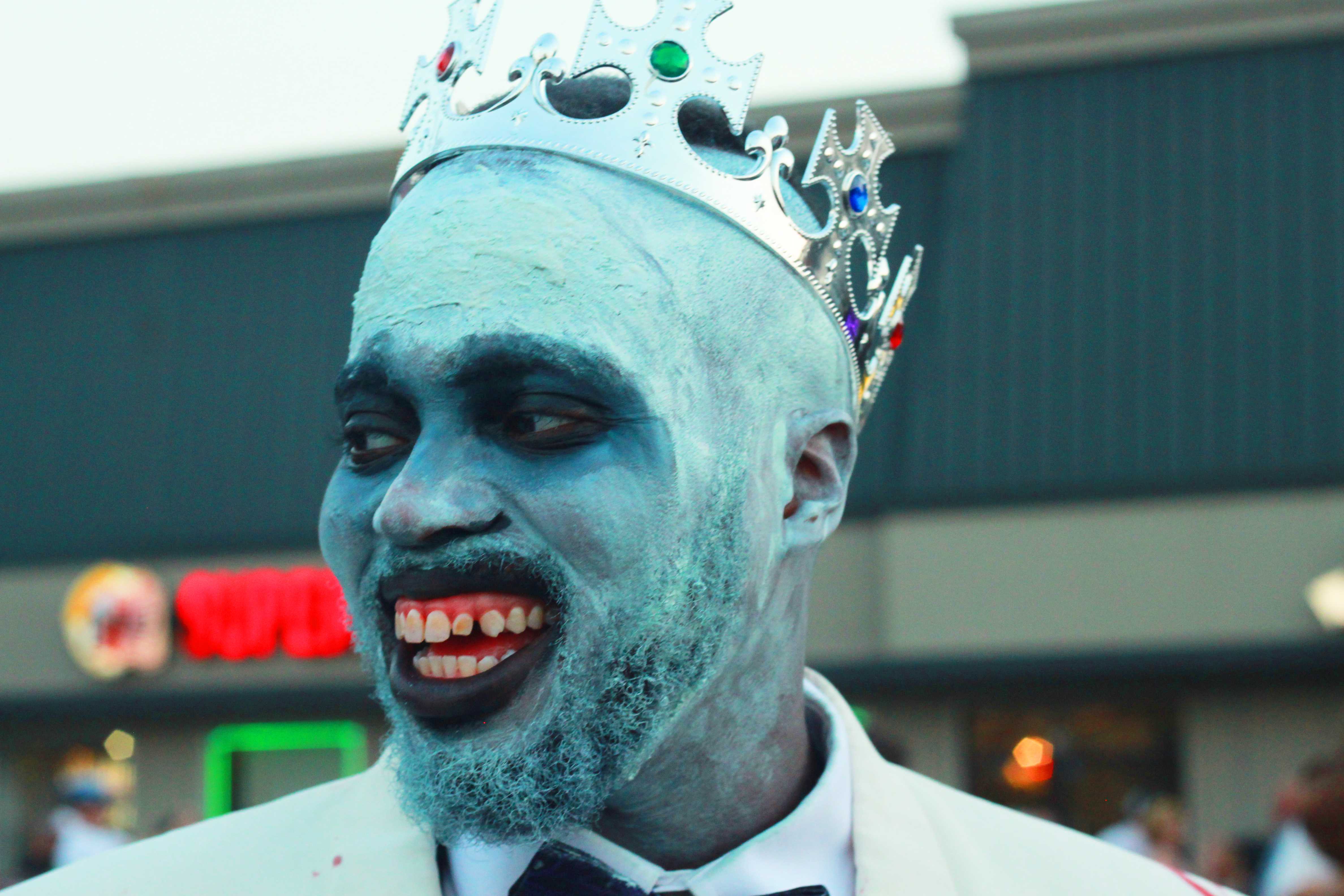 A zombie king eagerly awaits the walk.