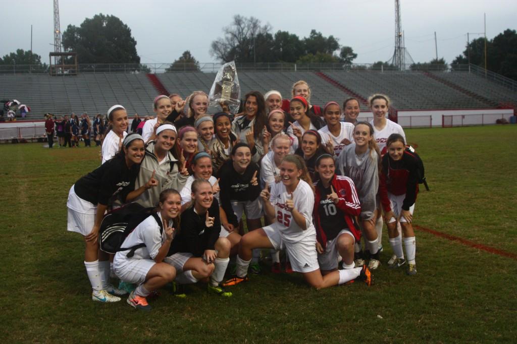 Manual girls varsity soccer wins district champion trophy with a final score of 10-0