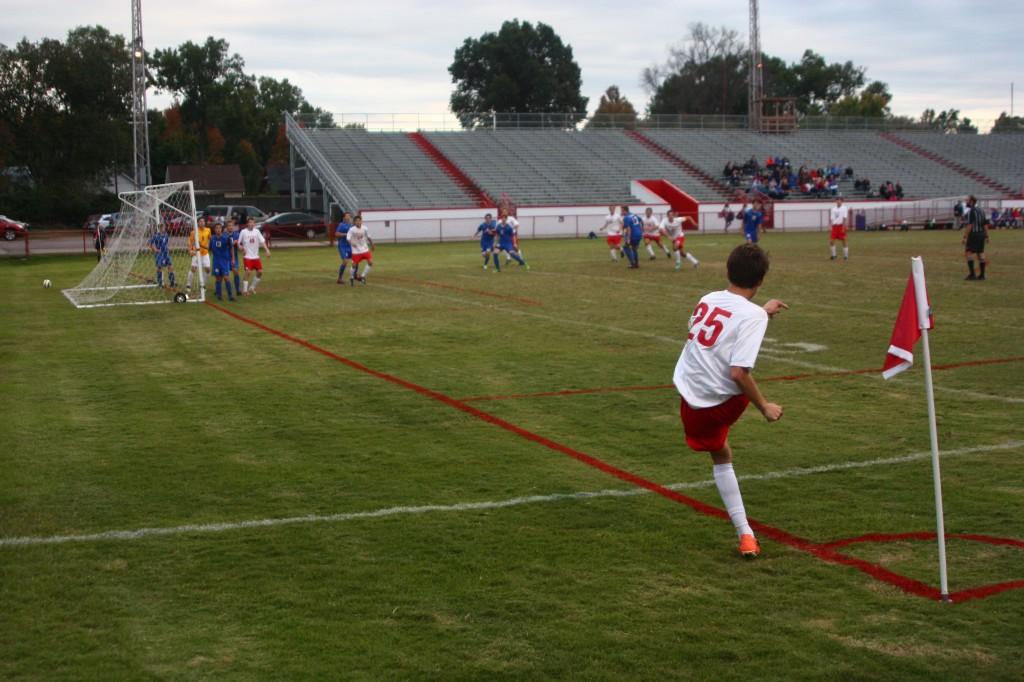 Riley Hook (10, #25) takes a  corner kick from the home side corner