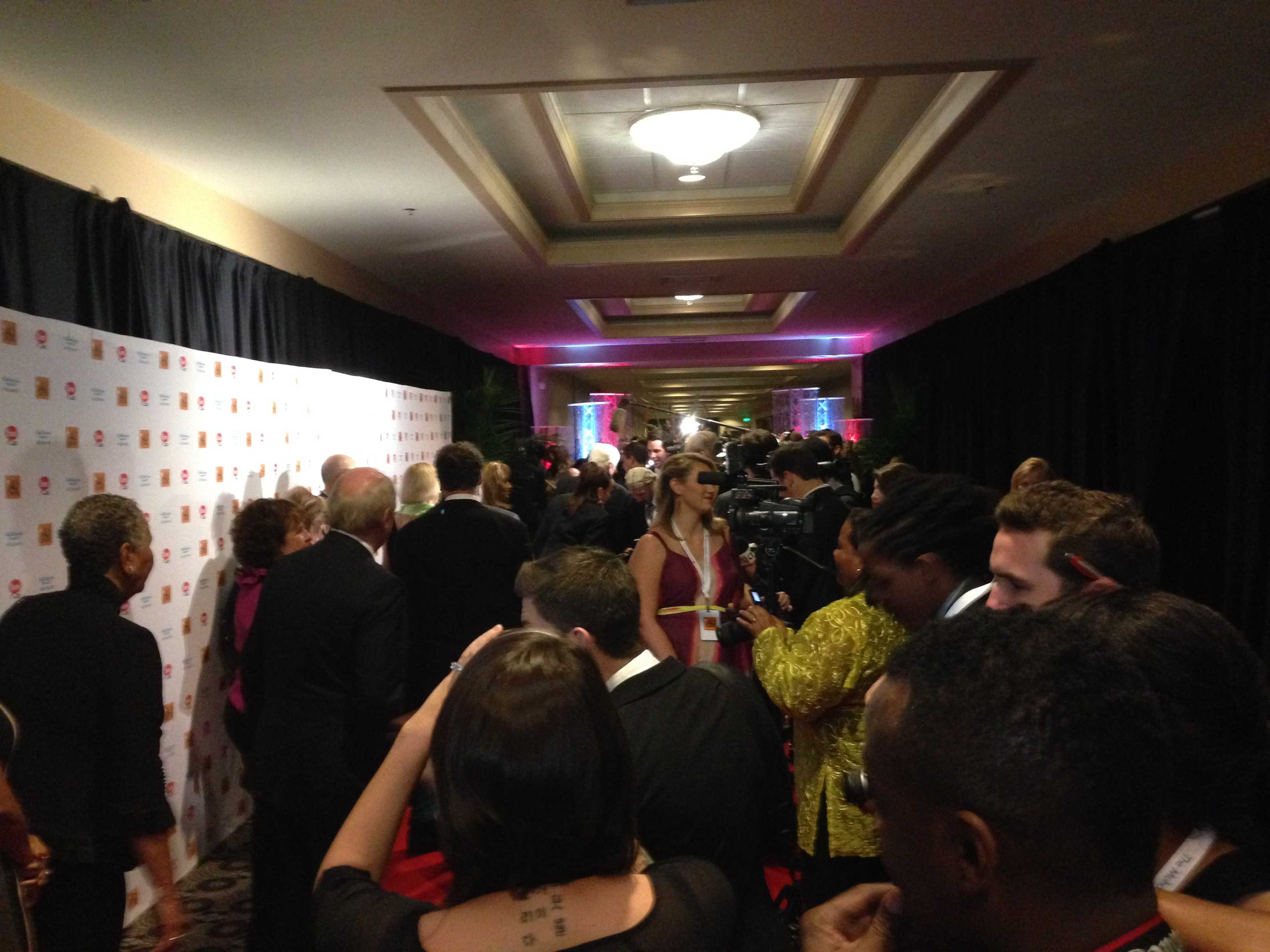 Special Guests and journalists line the red carpet at the Humanitarian Awards