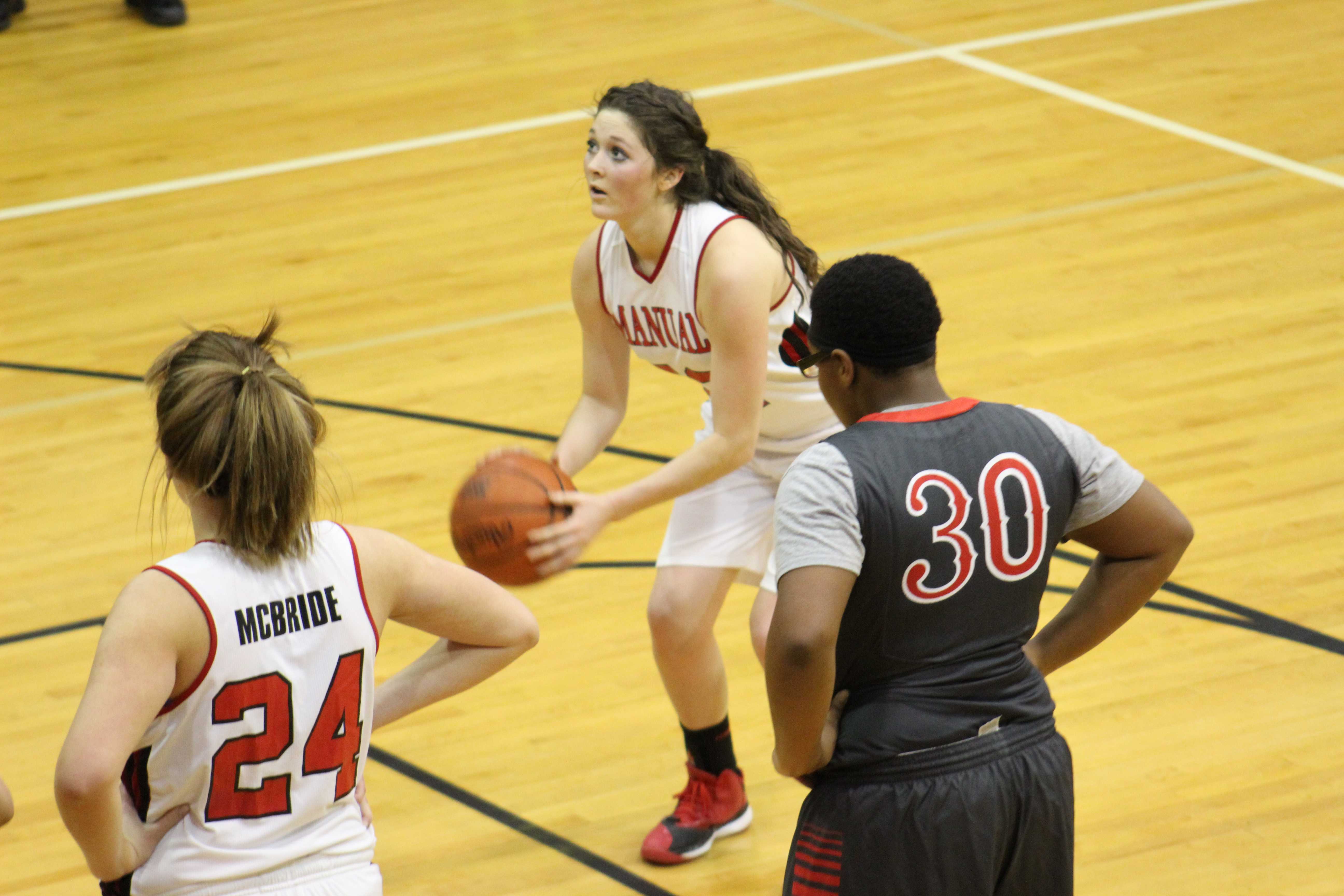 Sydney MacBlane (11, #22)  shoots a free-throw to give the Lady Crimsons a 26 point lead in the third quarter. 