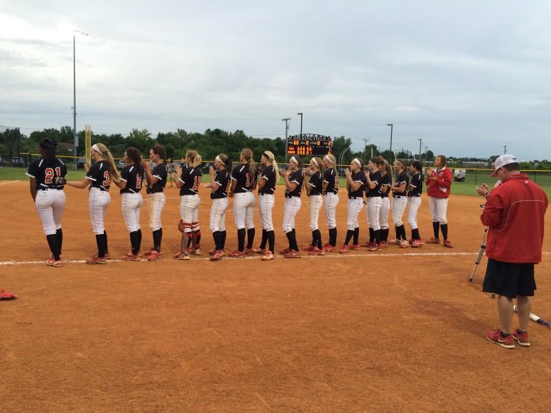 The duPont Manual softball team lines up after the game to be honored as the 25th District champions. This photo was taken pre COVID-19. Photo by RJ Radcliffe