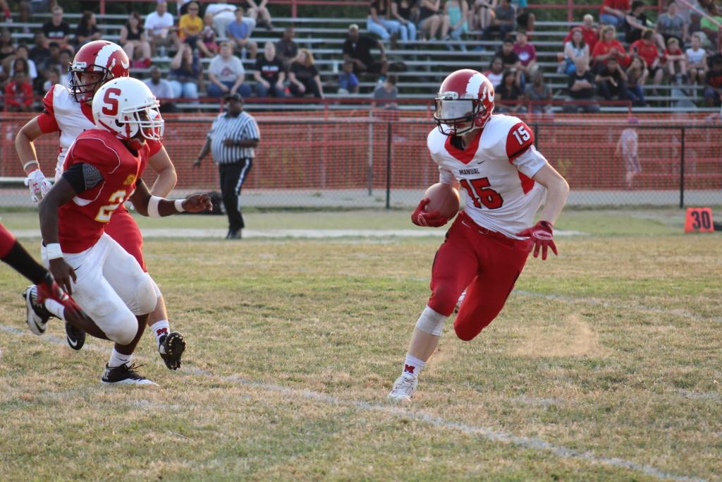Will Marshall (#15) runs for a 50 yard touchdown on first down in the first quarter. Photo by Kate Hatter
