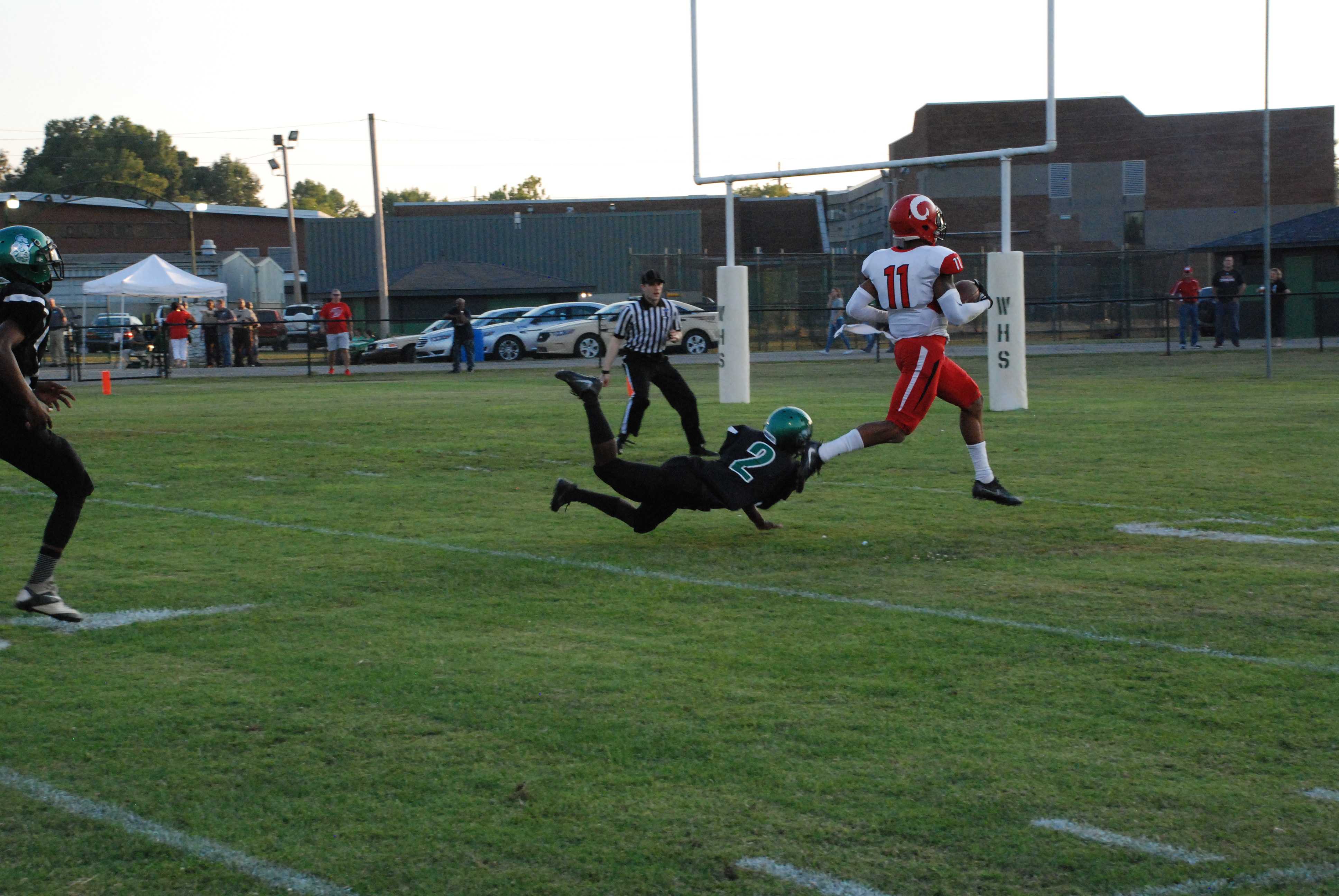 Jaelin Carter (11, 12)  running the ball into the end zone with the first touchdown of the night. 