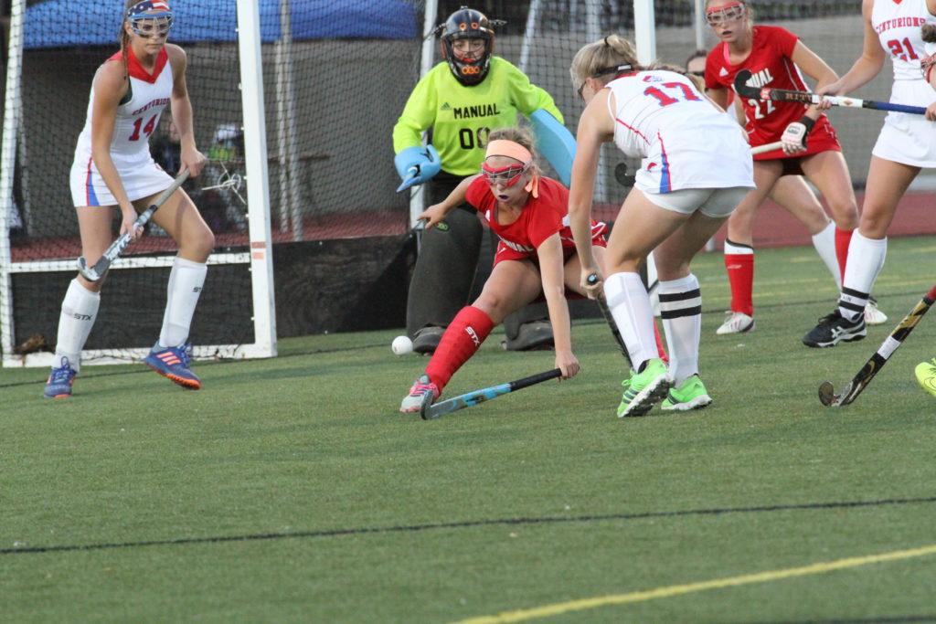 Ellie Wheatley (7, 9) defends the cage with a CAL shot on goal. Photo by Mr. Bowman 