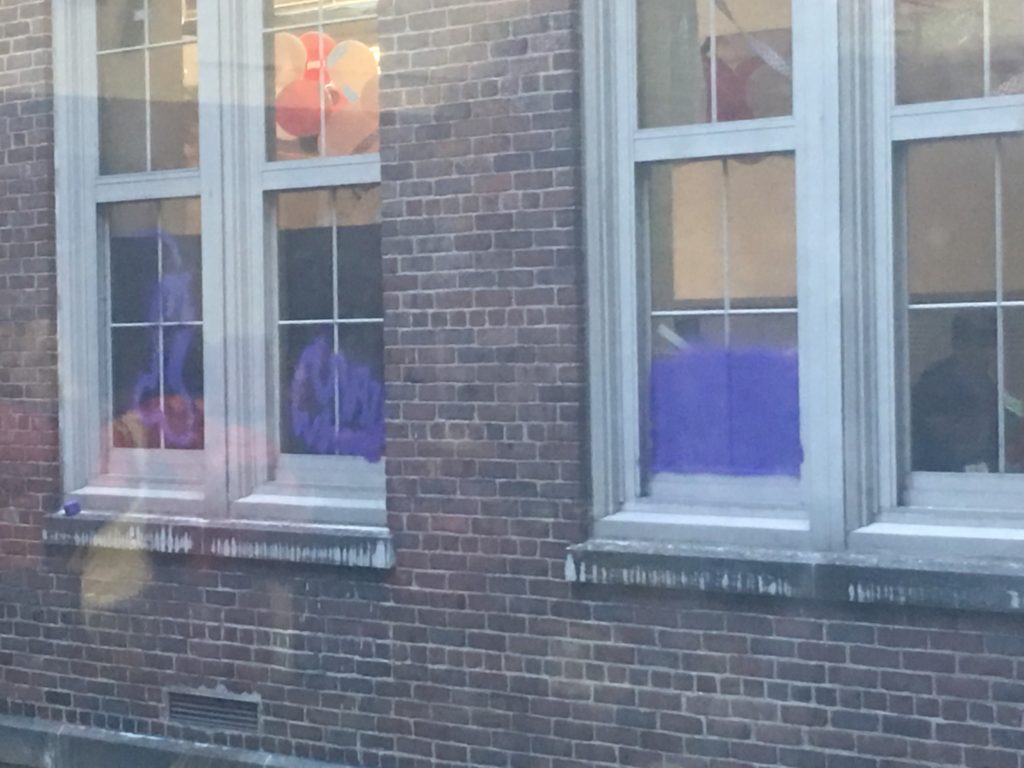 Purple spray paint mars windows in the hallway near Mr. Krauses classroom.