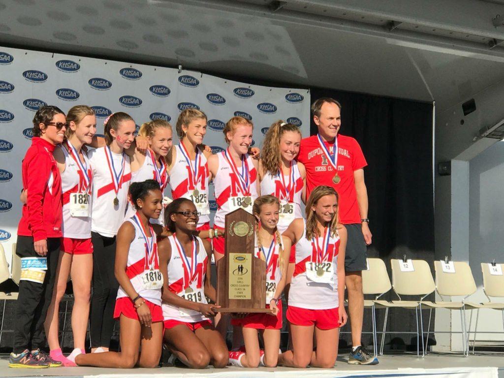 The girls cross country team poses with the first place trophy at the state competition. Photo courtesy of Alena Sapienza-Wright.