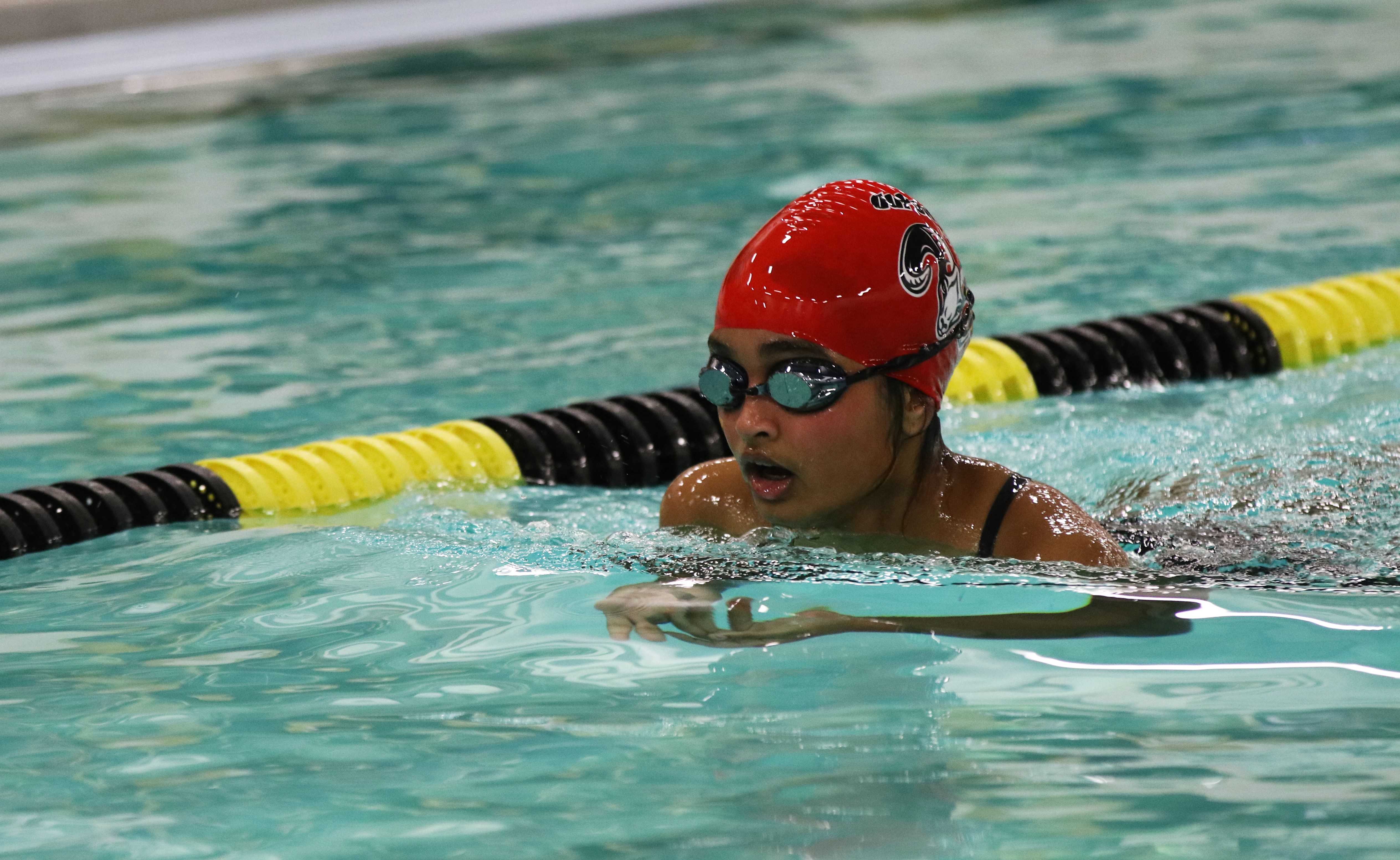 A freshman swimmer competes in the breaststroke heat. Photo by Grace Bradley. 