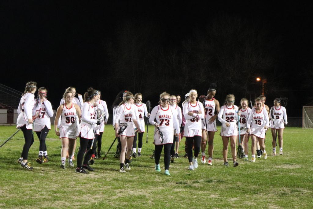 The+lacrosse+girls+coming+off+the+field+after+their+13-3+win+against+Atherton.+