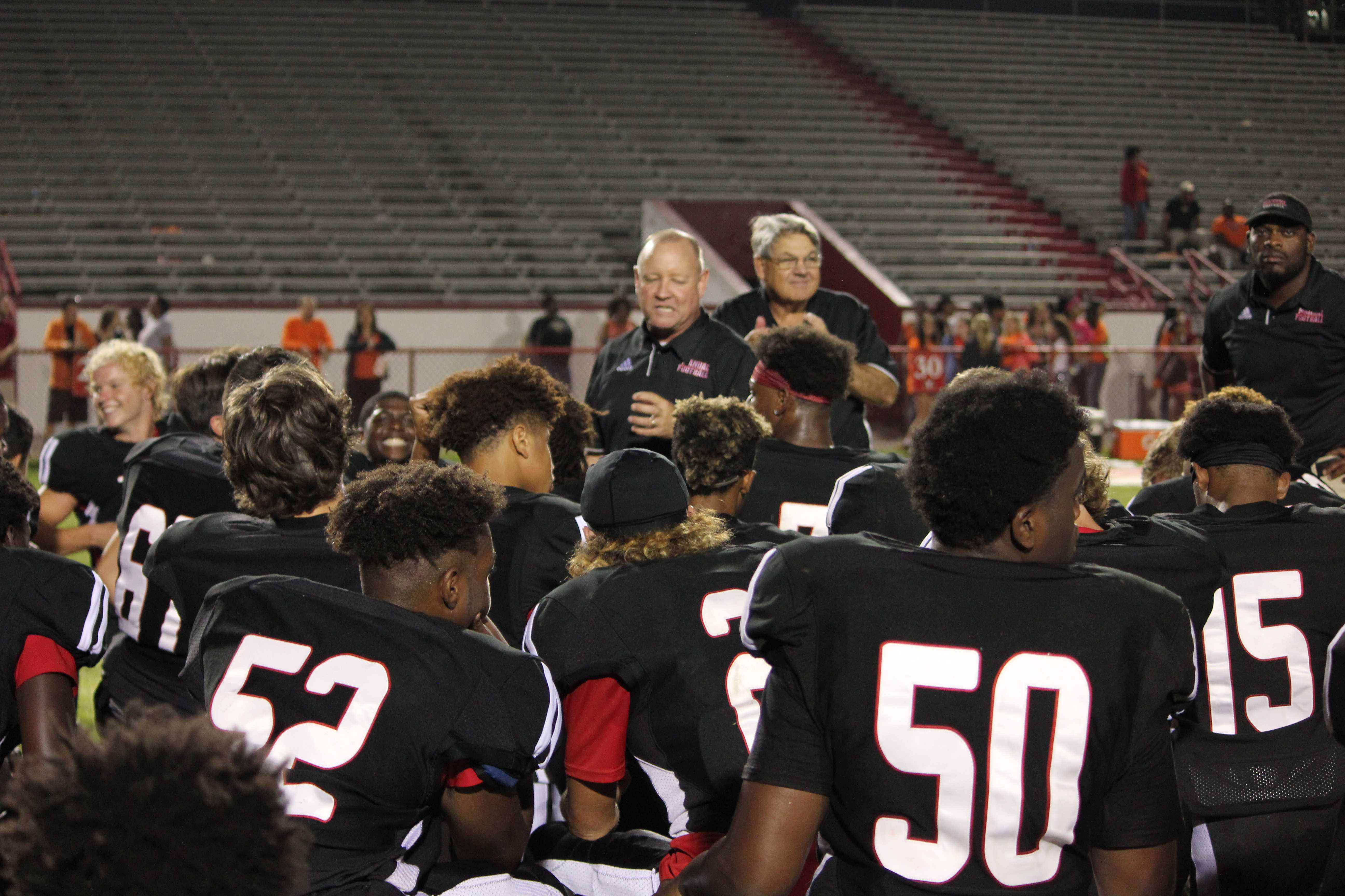 Manual head coach, Scott Carmony, talks to the team after the game. “After a game like this, we’re feeling really good,” Carmony said. Photo by EP Presnell.