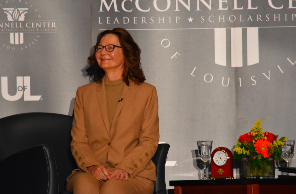 Gina Haspel smiles at an enthusiastic and applauding crowd as she joins Mitch McConnell and Scott Jennings on the stage. Photo by Piper Hansen.