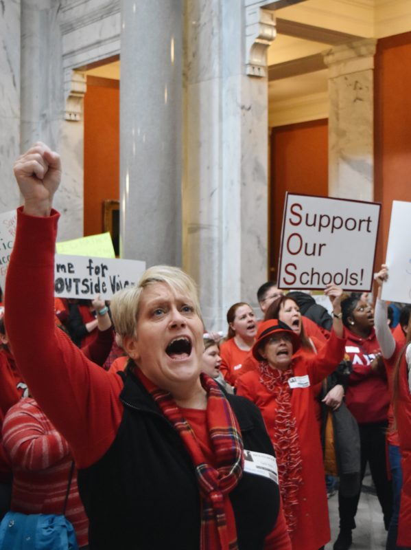 Teachers+and+students+dressed+in+red+headed+to+the+capitol+building+again+today+for+the+third+sick-out+in+one+week.