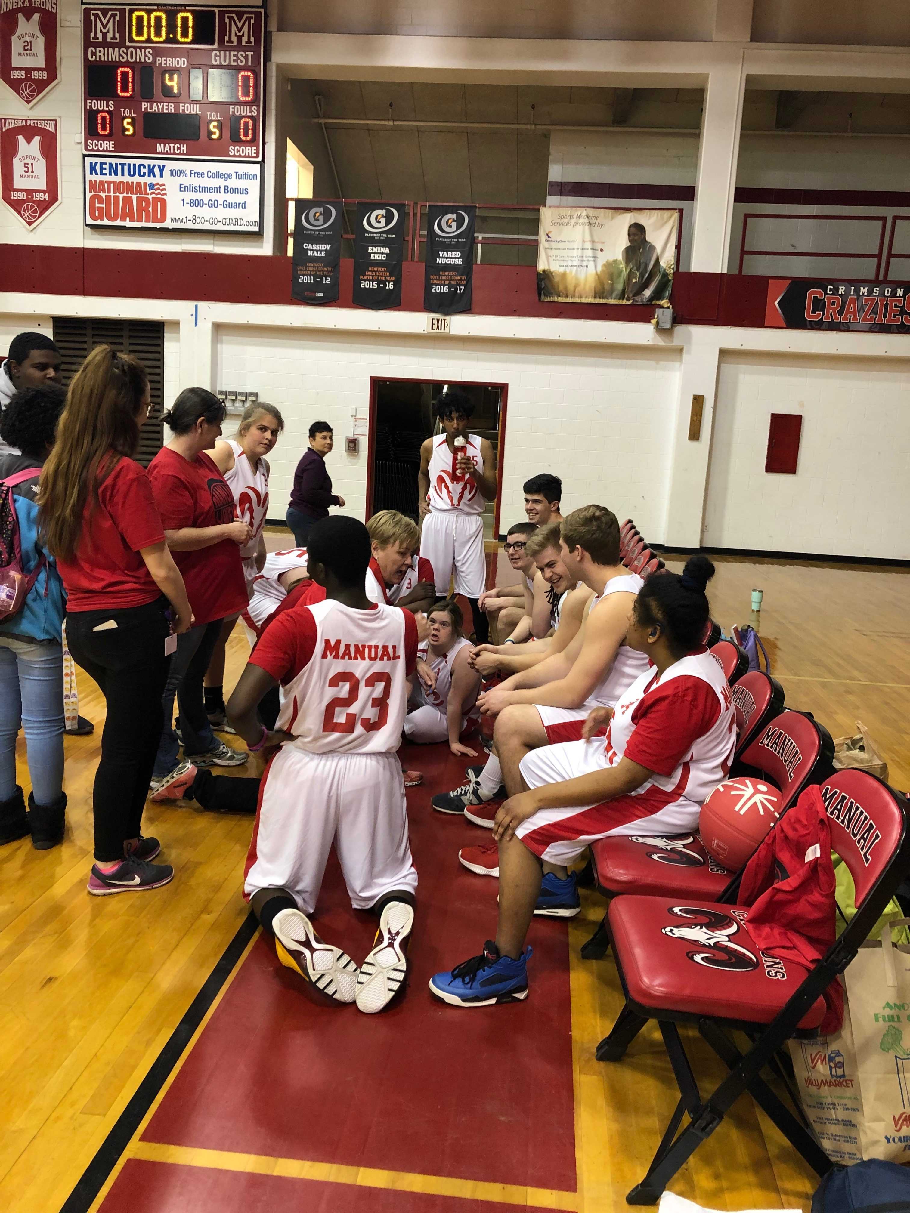 Manual Unified Basketball Team meets together after their game with eastern