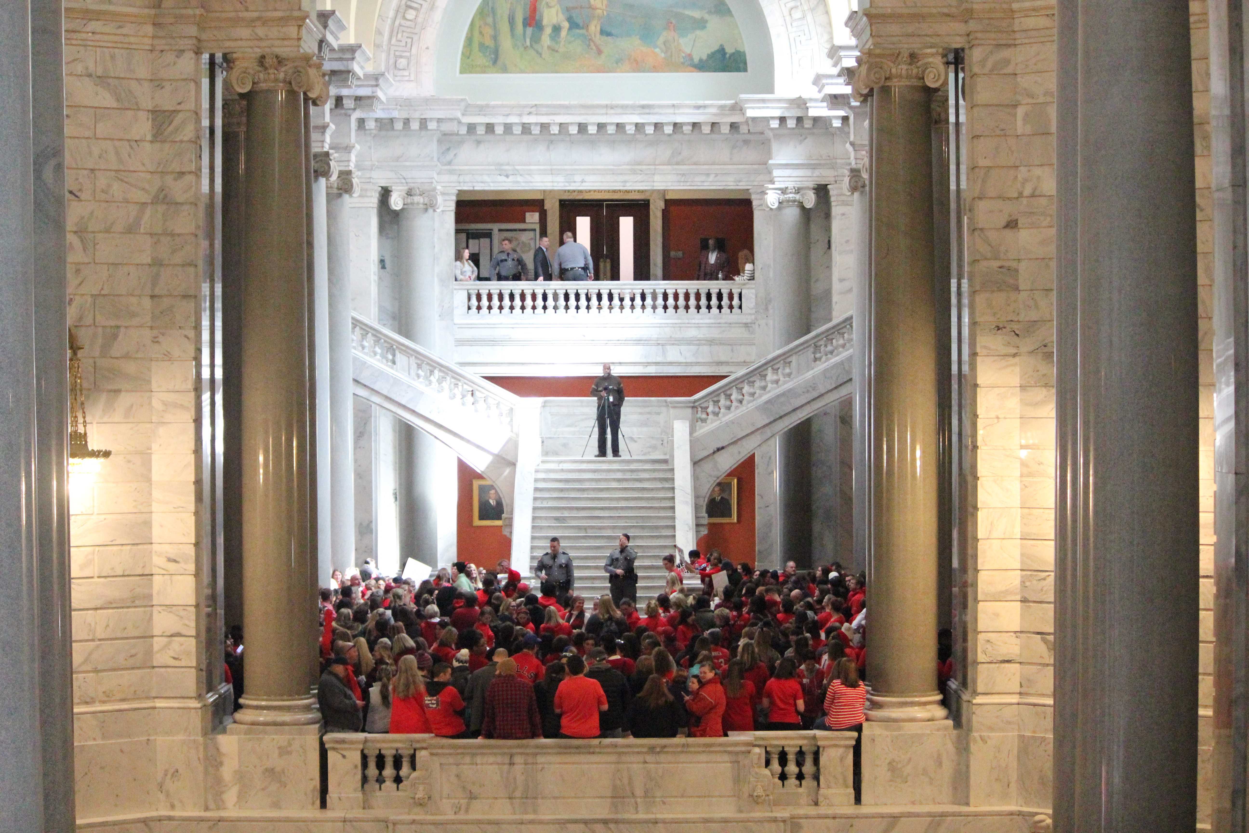 Teachers in the rotunda crowd together to sing and chant against House and Senate Bills. Photo by Emma E.P. Presnell