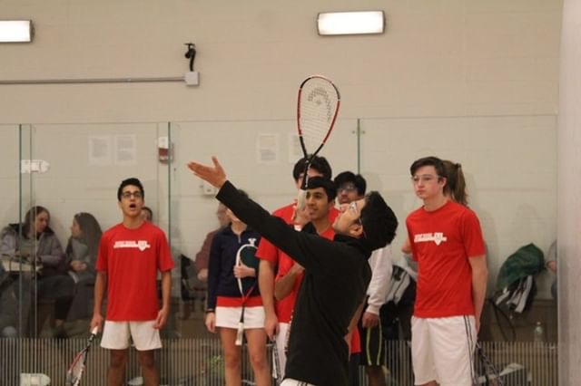 The Manual squash team warms up before games at the National tournament in Connecticut. Photo by Maeve Watts-Roy. 