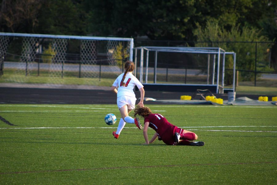  Mia Schecter (9, MST) slips past the Assumption defender, Josie Deye, which sets Schecter up for a shot on goal. Photo by Anna Schroll. 
