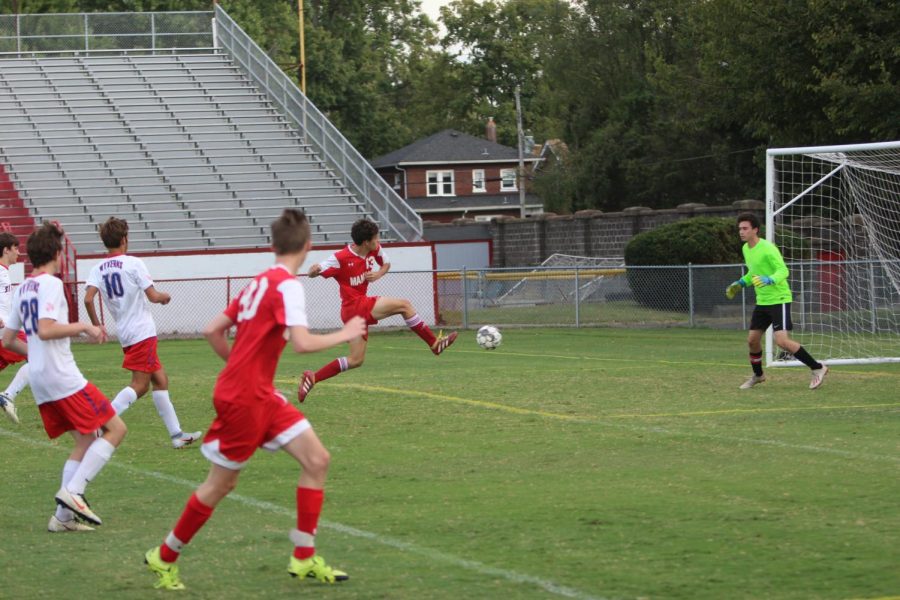 Forward Niko Sapienza leaps into a shot that would turn into a goal for Manual. Photo by Euan Dunn.
