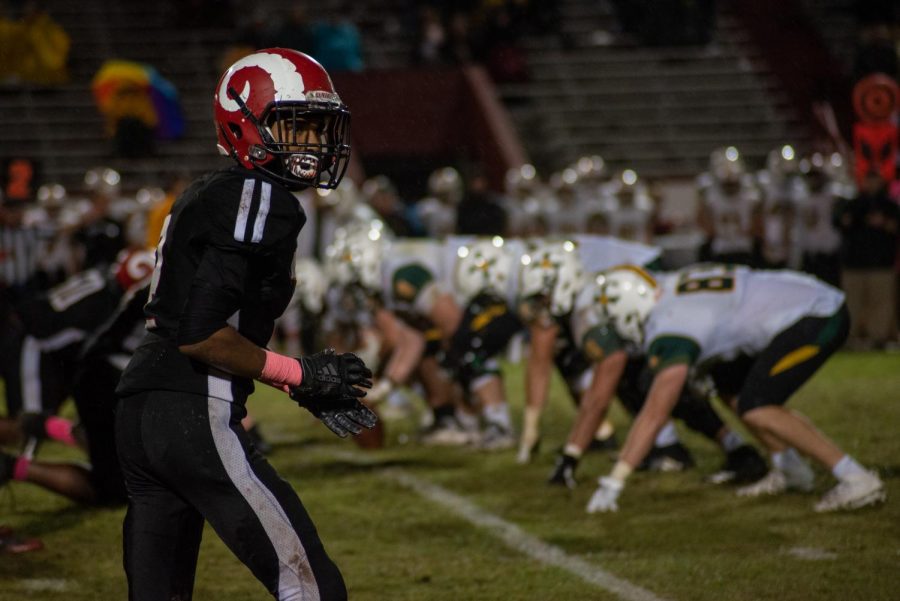 Manual's Tavon Johnson (#11, 10) prepares to run his wide receiver route during the regular season game against St. X earlier this year. Photo by Cesca Campisano.