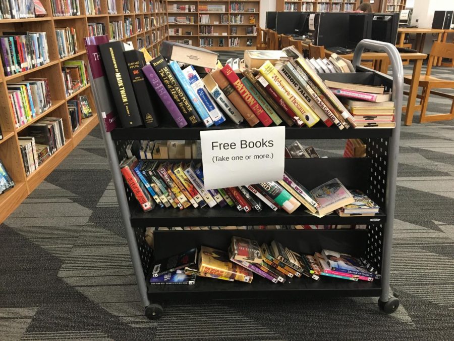 A cart full of free books that the librarians were offering to students. Photo by Mandala Gupta VerWiebe