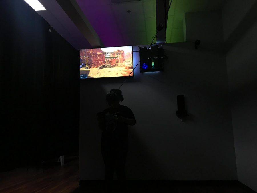 Manual student Ohana Hyllberg plays Arizona Sunshine at Dimension 4 VR.