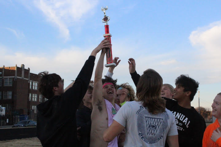 Team Ween raises their trophy in the air after winning the Crimsons Against Cancer kickball tournament. Photo by Morgan David.