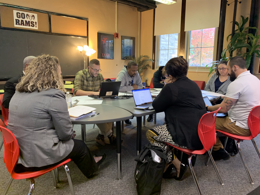 At the SBDM meeting, teachers and administrators review policies and discuss updates for Manual and YPAS. Photo by Reece Gunther.