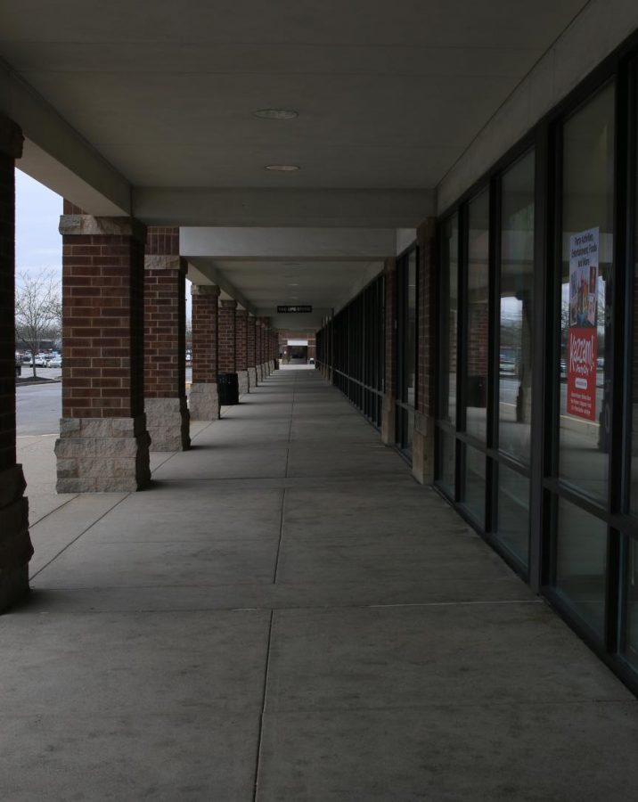 A shopping center near the South Central Library, including a Party City and multiple clothing stores is empty. Photo by EP Presnell.
