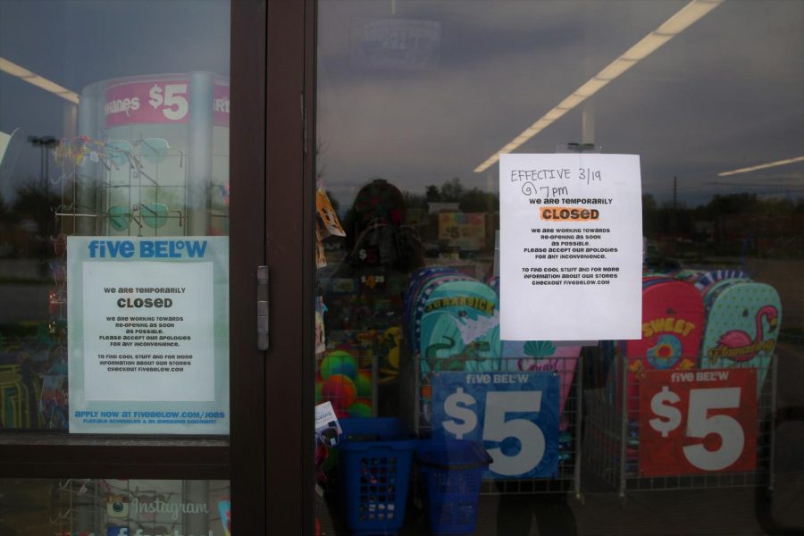 Five Below, a bargain store, is closed with signs telling customers they will not be open. Photo by EP Presnell.