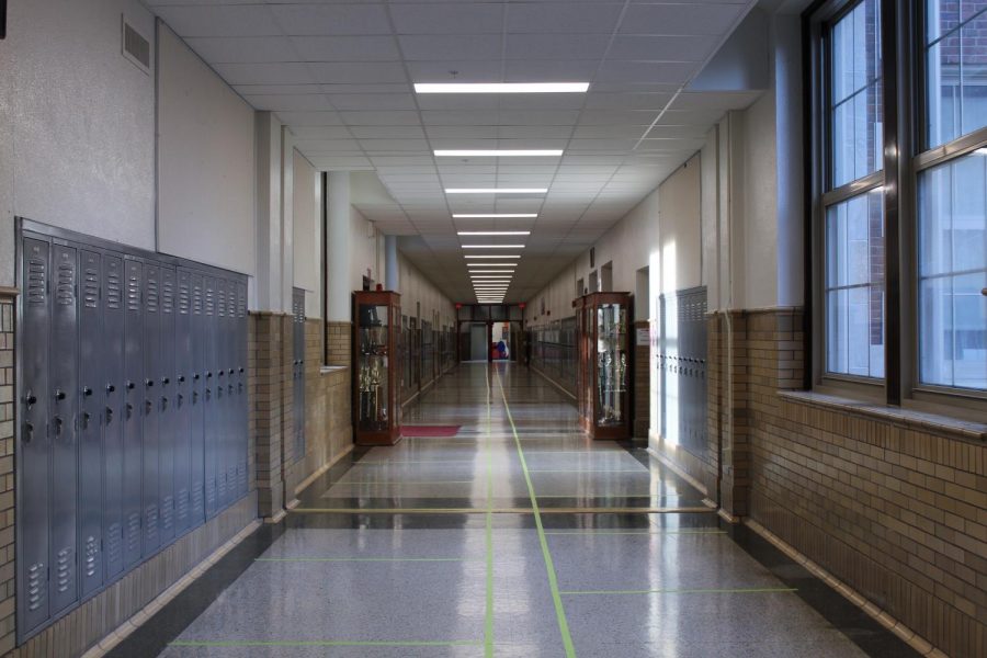 Tape outlines left and right lanes in order to maintain social distancing in the hallways.