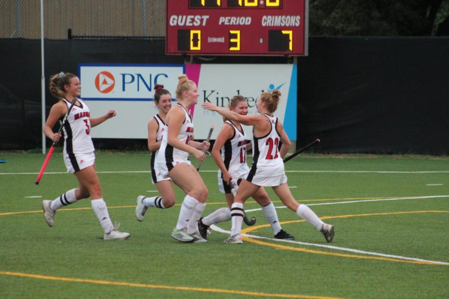 Field hockey team cheering during their regular season game against Male. Photo courtesy yearbook. 