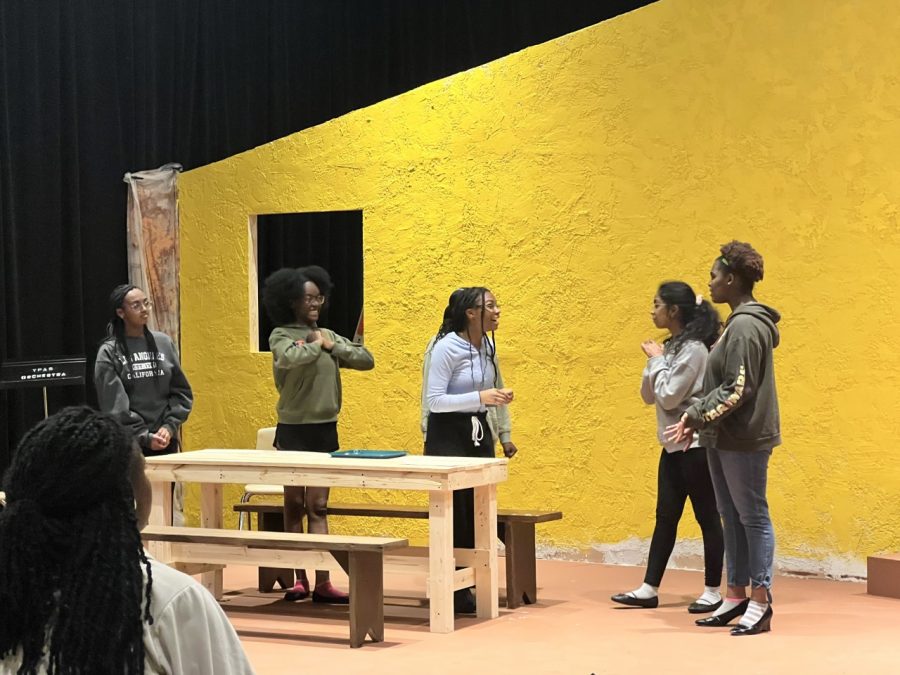 Cast members rehearsing an opening scene in the Black Box Theater where they will be performing. Photo by Jazmine Martinez.