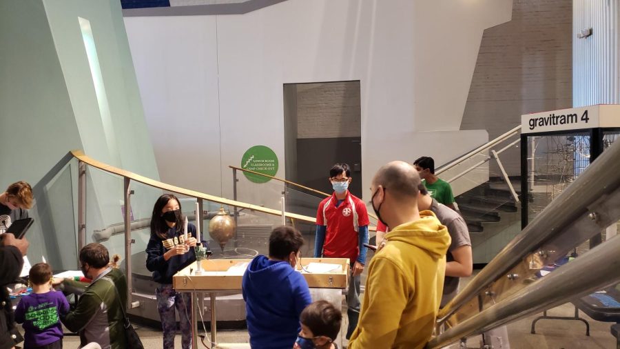 The team works with young visitors at the science center