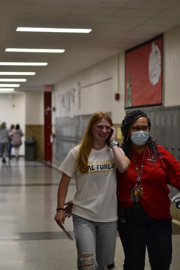 Guidance Counselor Ms. Leslie walks with the final senior in the line through the third floor. Photo by Eddie Hickerson