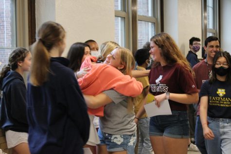 A senior embraces their underclassman friend as they go on their final walk through the building. Photo by Ana Rodriguez