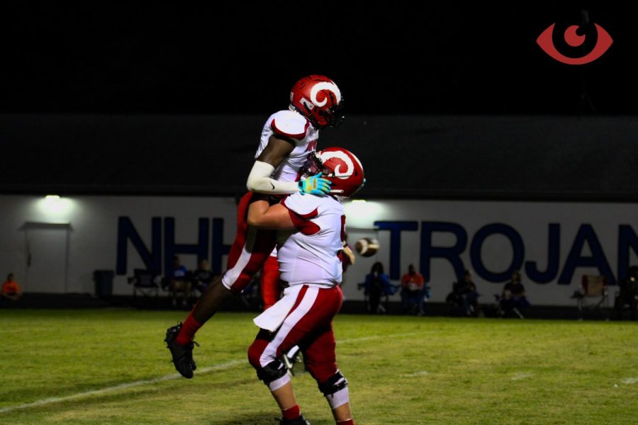 Two Manual Players embrace after scoring a touchdown. Photo by Morgan Schmidt