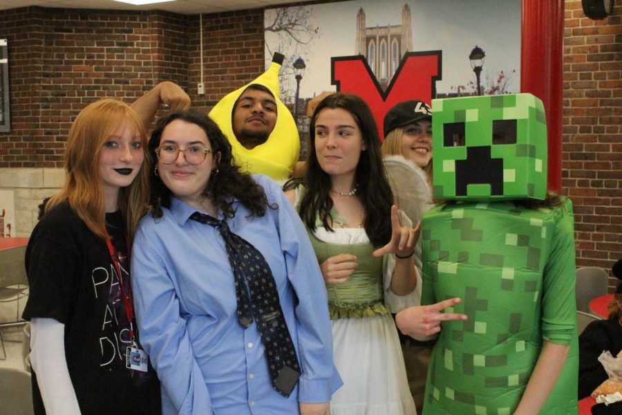 A group of Manual students in costumes such as a banana and a Minecraft creeper. 