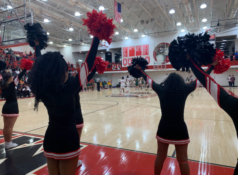 Manual’s cheerleaders cheer on the team. Photo by Katie Dikes