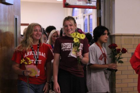 The seniors begin to leave the gym, kicking off the annual senior walk. Photo by Ava Blair