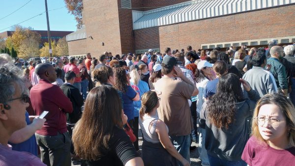 Manual parents wait outside school to pick up their children after Wednesdays lockdown. Photo by Cheryl Ellis.