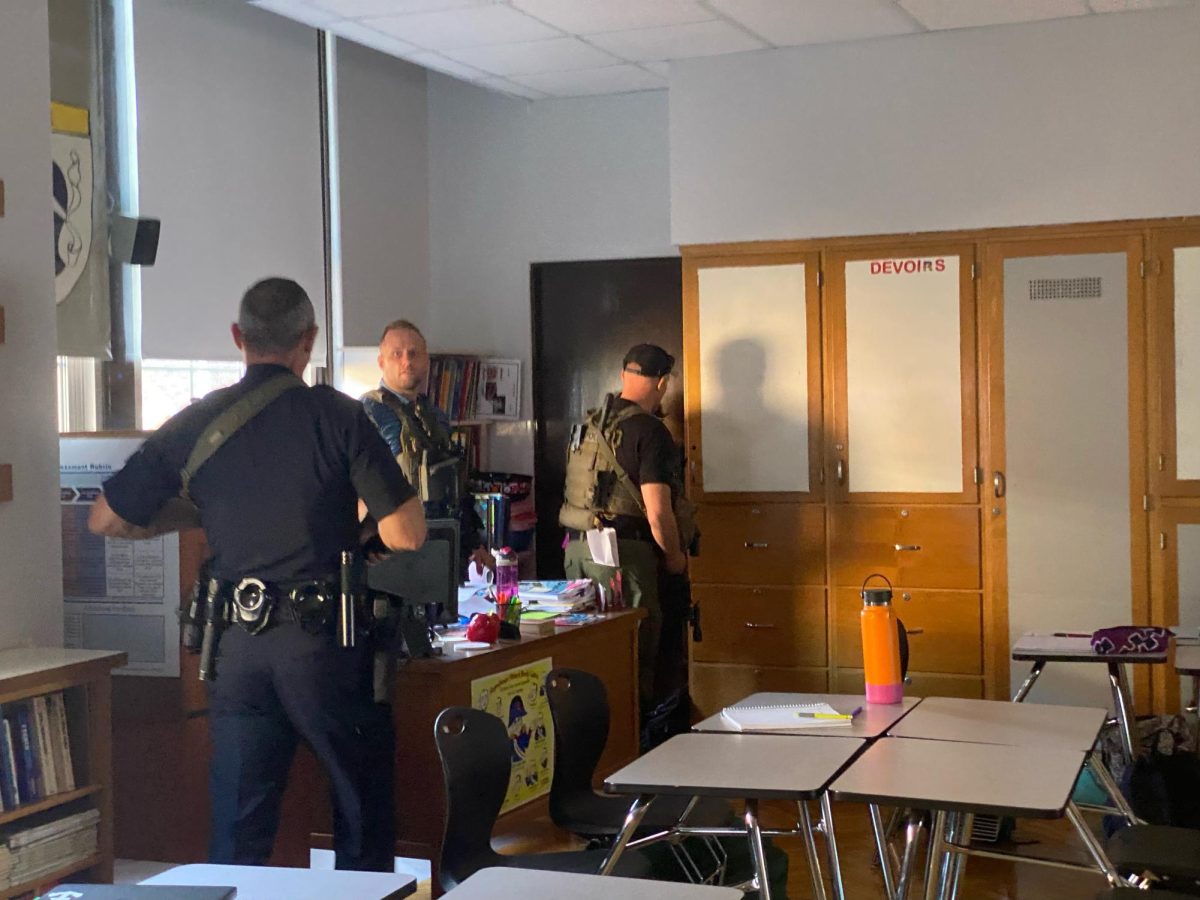LMPD officers and SWAT officials clearing a French classroom at Manual. 