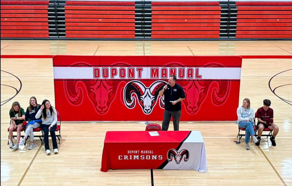 Athletic Director, David Zuberer, recognizing the five seniors signing National Letters of Intent. (Photo courtesy of Principal Dr. Newmans Twitter.)