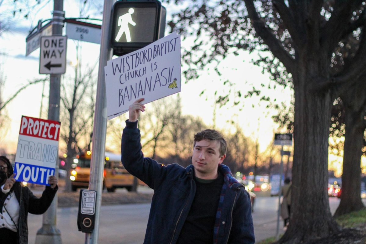 A counter-protestor with a sign that reads Westboro Baptist Church is bananas!! Photo by Ava Blair