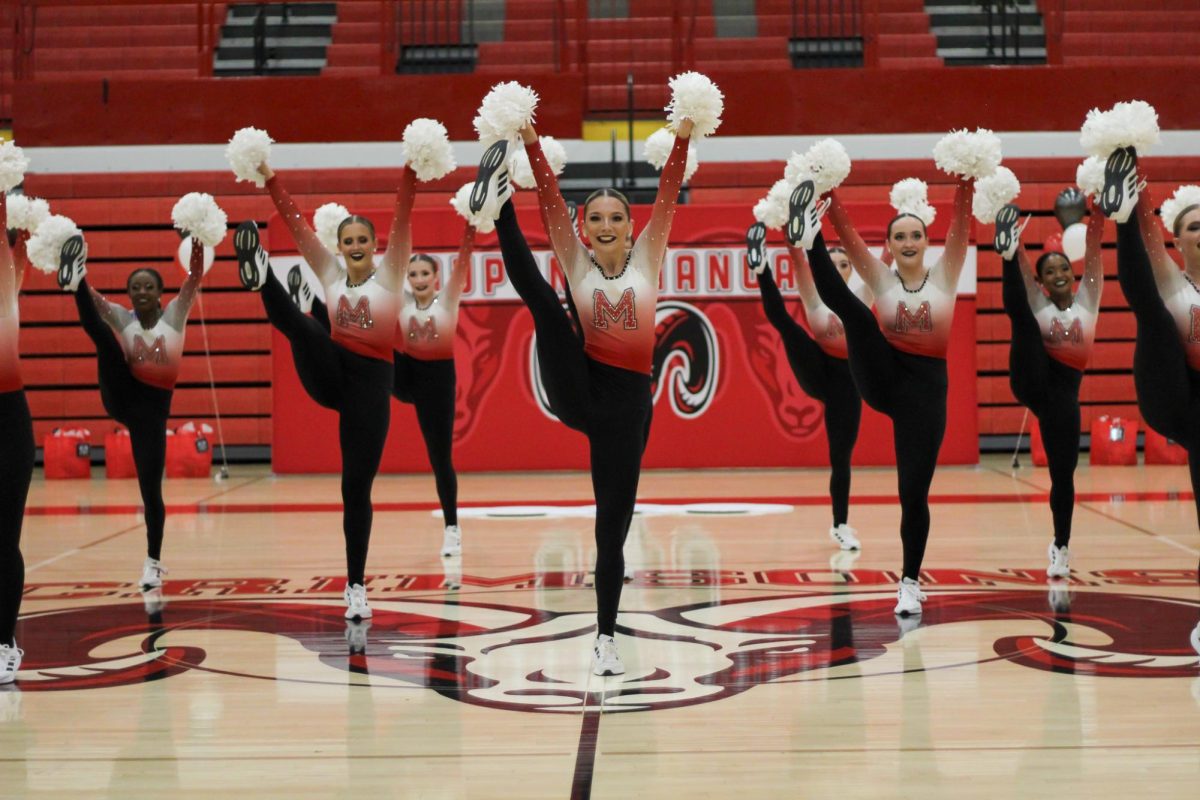 The Dazzlers doing a high kick during their hiphop routine. Photo by Ava Blair