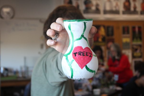 Members of the Environmental Club painted flower pots together during one of their meetings. Photo by Stella Kolers
